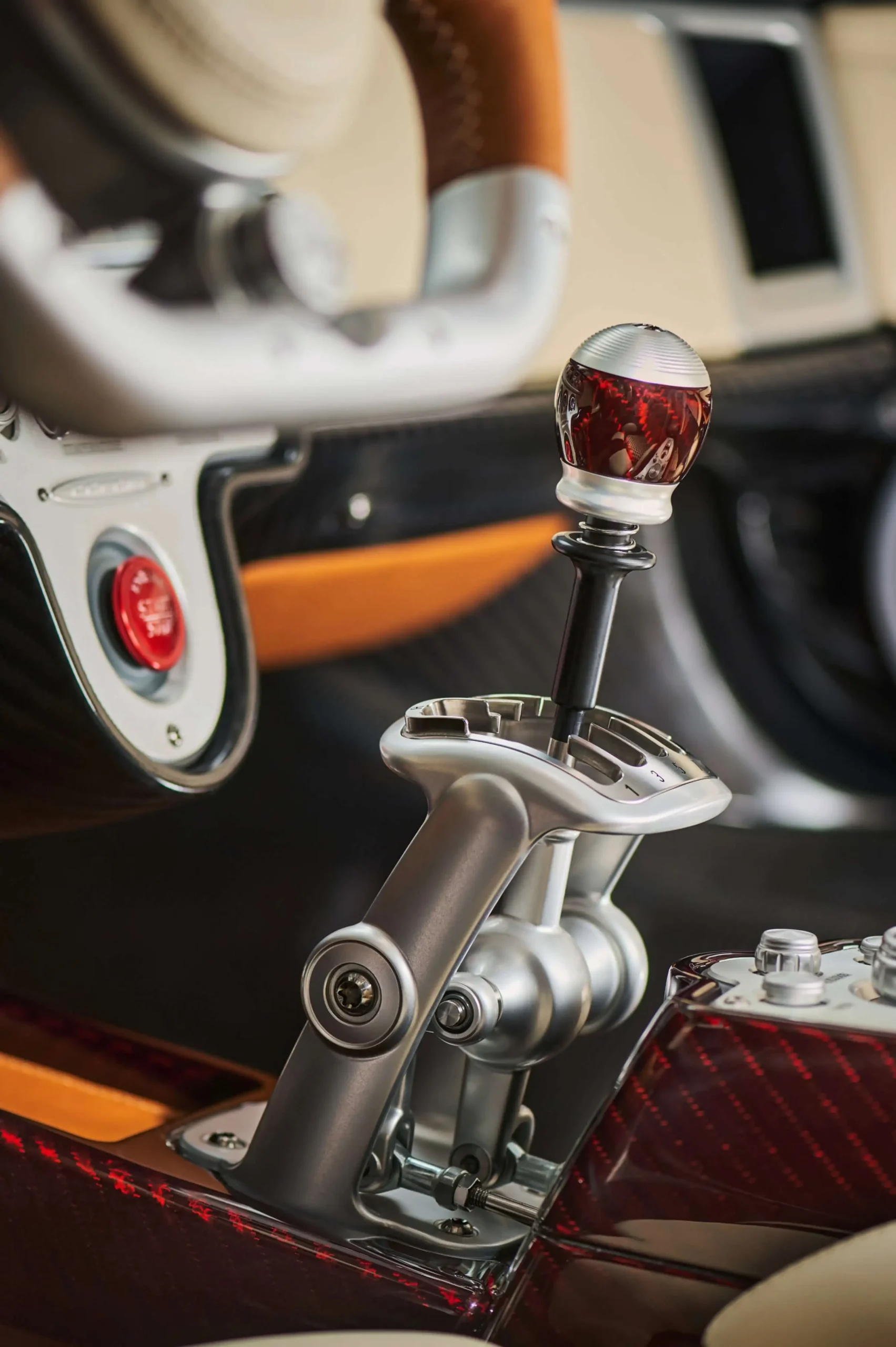 Detailed close-up of the Pagani Utopia Roadster's exposed mechanical gated manual shifter linkage.